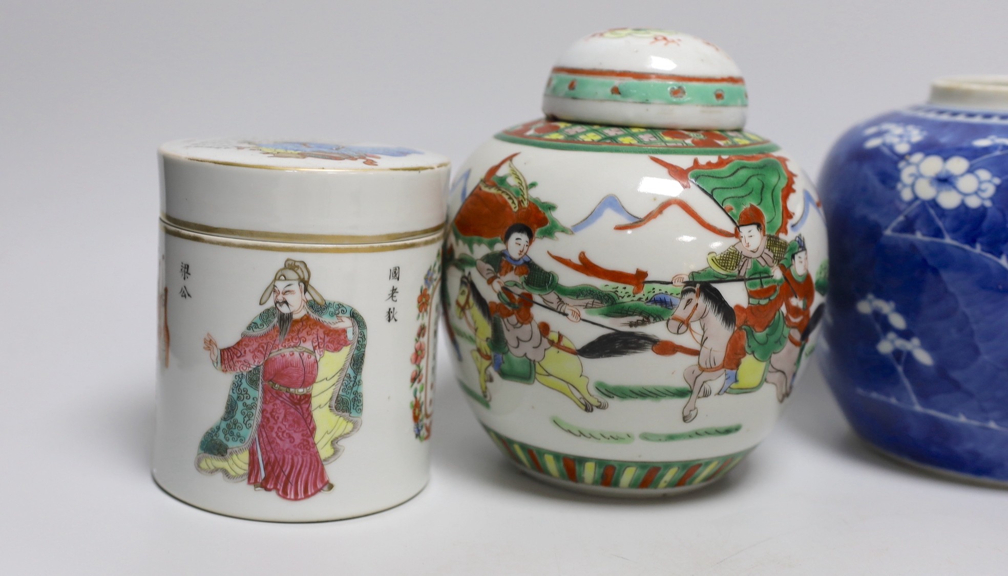 A 19th century Chinese famille rose box and cover, a blue and white prunus jar, two other jars, a figural brush rest and a cloisonne enamel dish